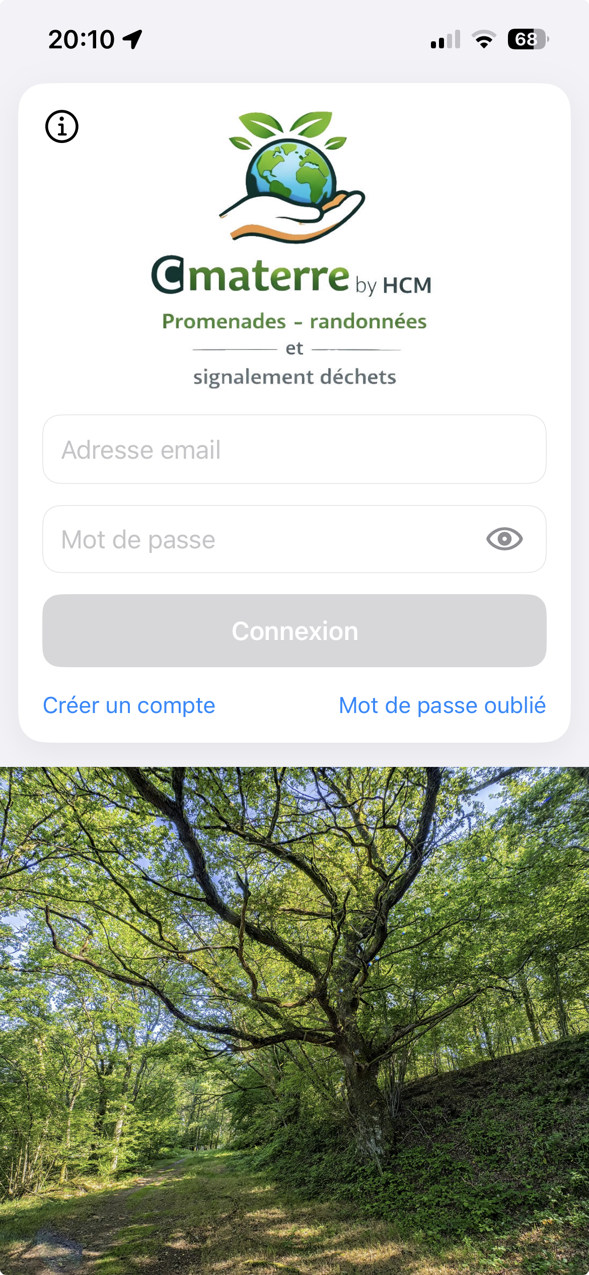 Écran d’accueil de l’application CMATERRE avec son logo et une forêt lumineuse
